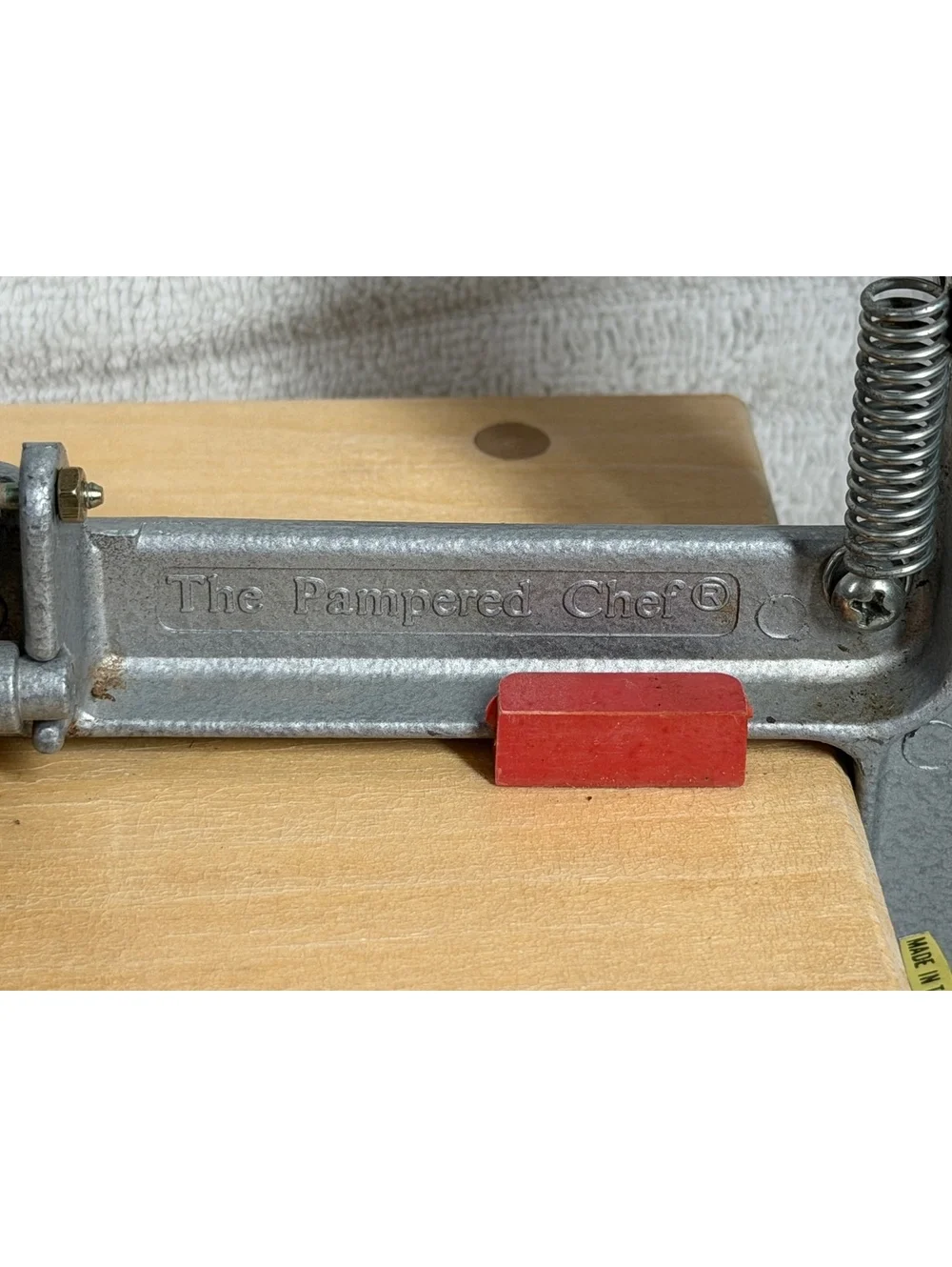 The Pampered Chef Apple Peeler with Wooden Base and Red Handle